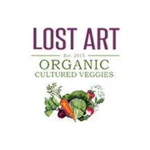 A white circle with the words " lost art organic cultured veggies ".