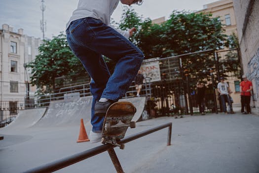 A person on a skateboard doing tricks on a rail.