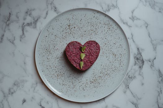 A heart shaped cake on top of a white plate.